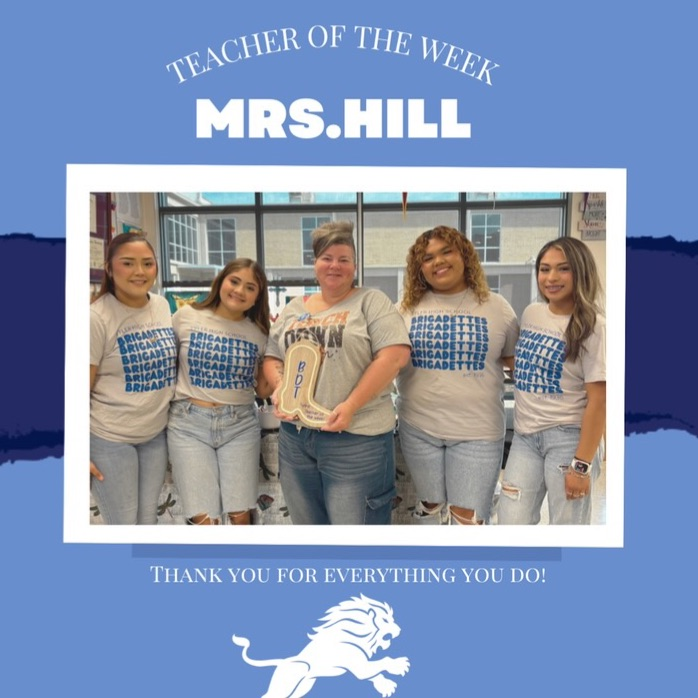 teacher and students posing for picture