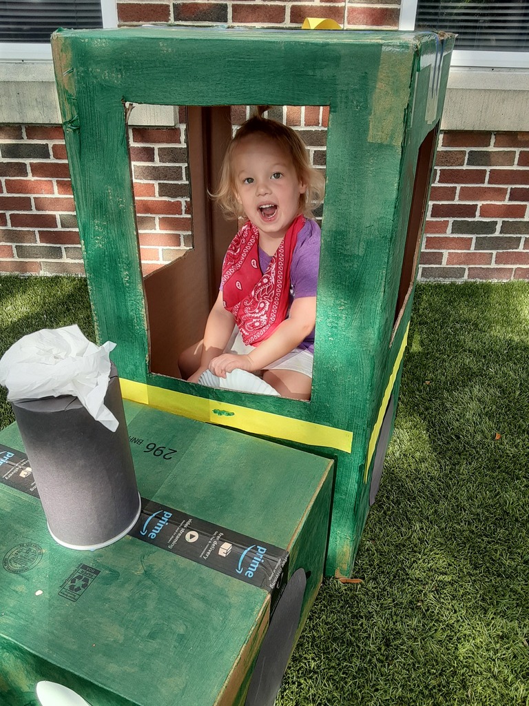 Child driving a pretend tractor