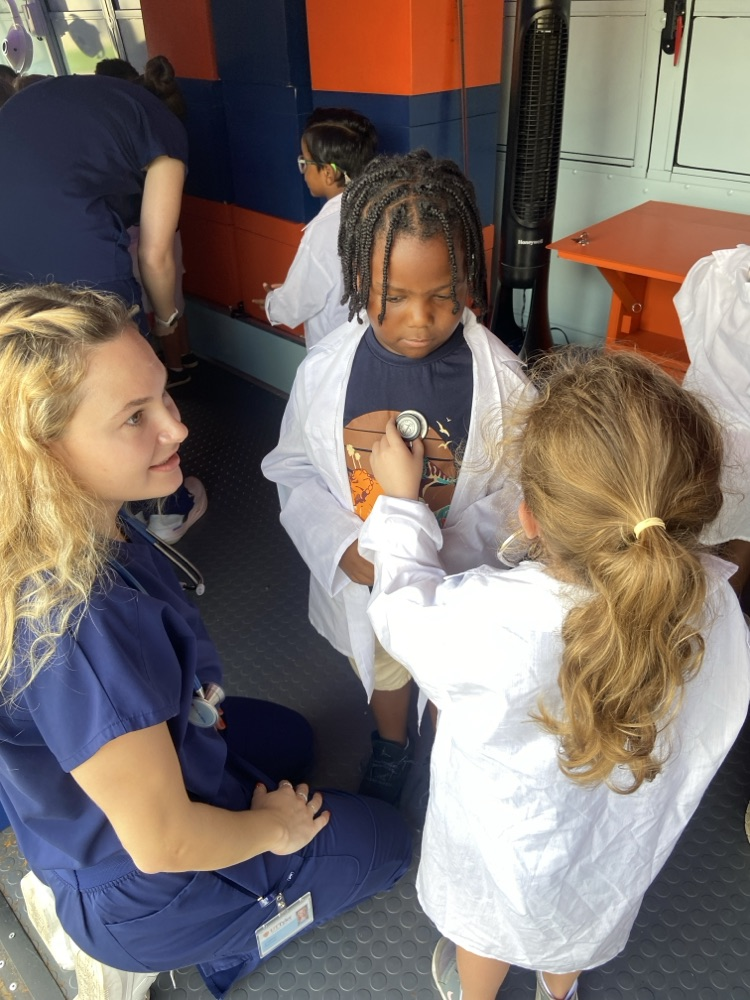 Children pretending to be doctors.