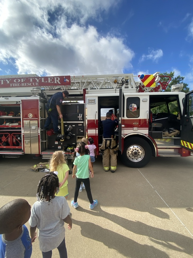 Children learning about firefighters