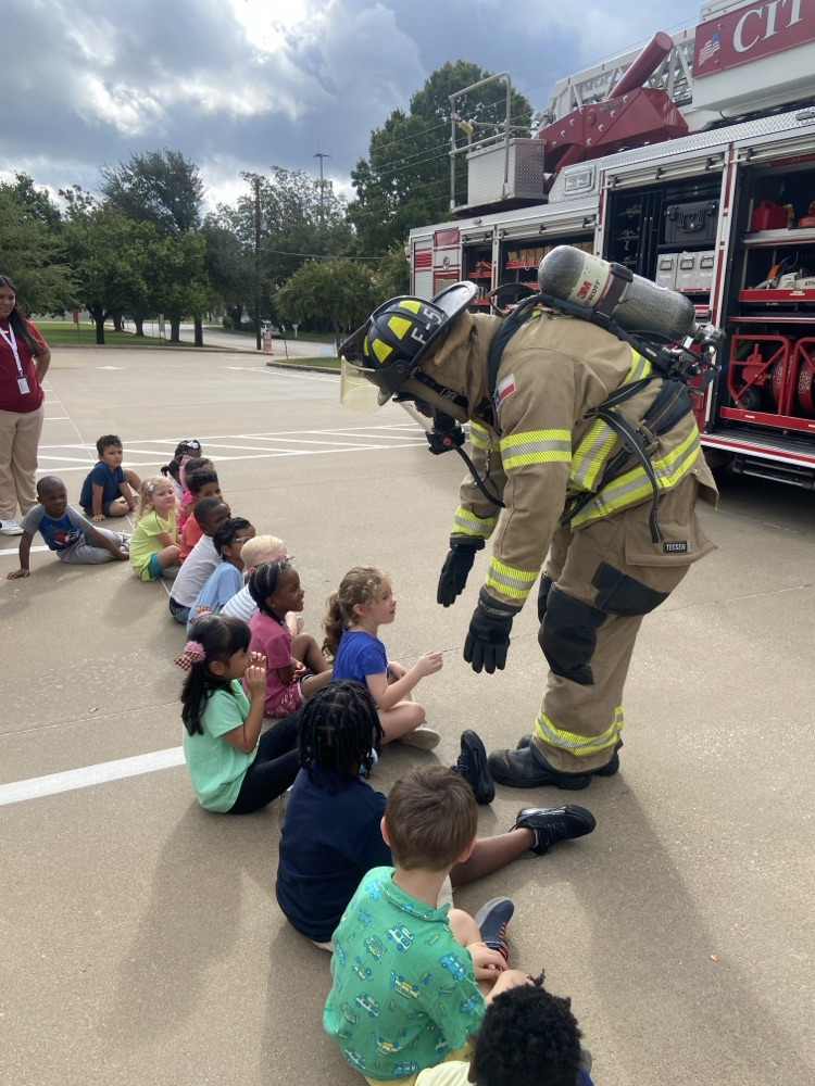 Children learning about firefighters.