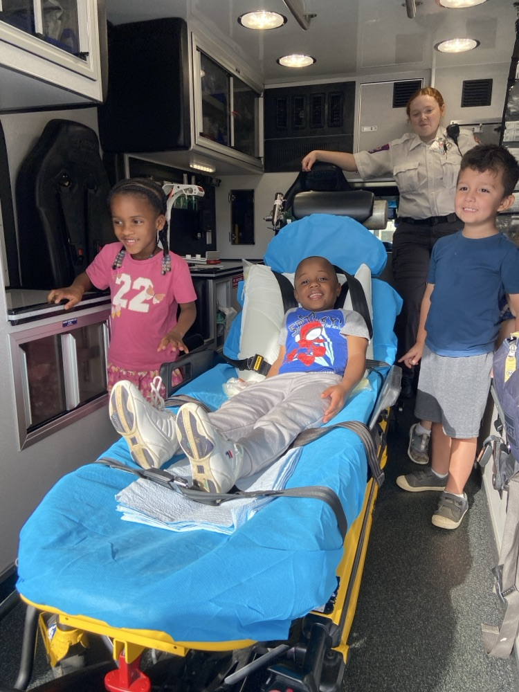 Children learning about ambulances.