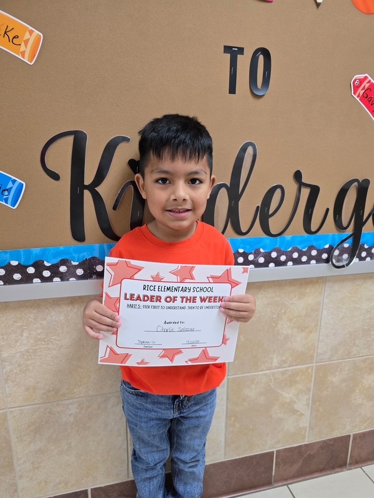 student holding a certificate