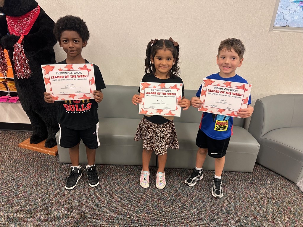 students holding certificates