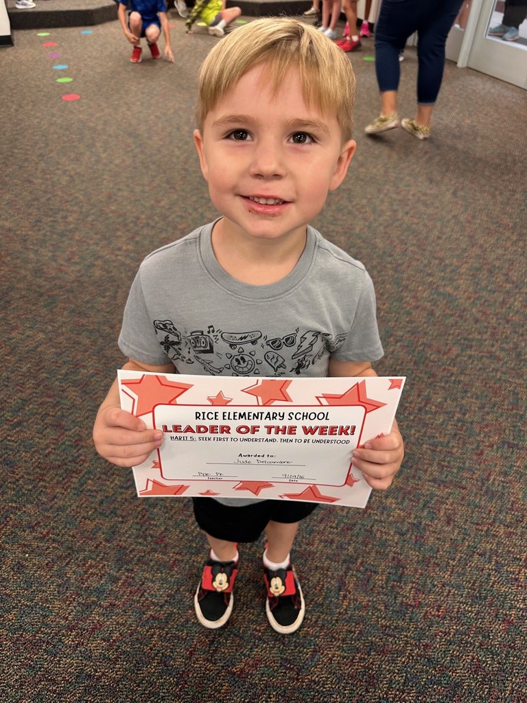 student holding a certificate