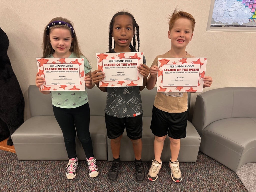 students holding certificates