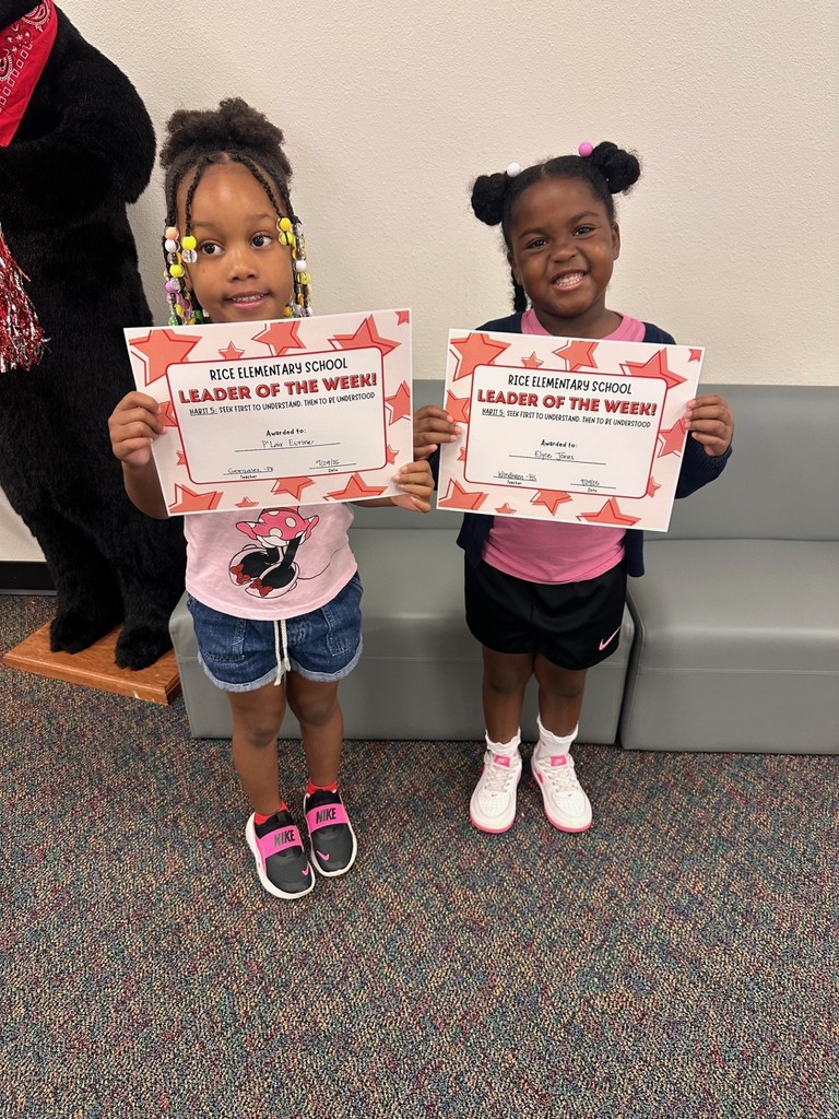 students holding certificates