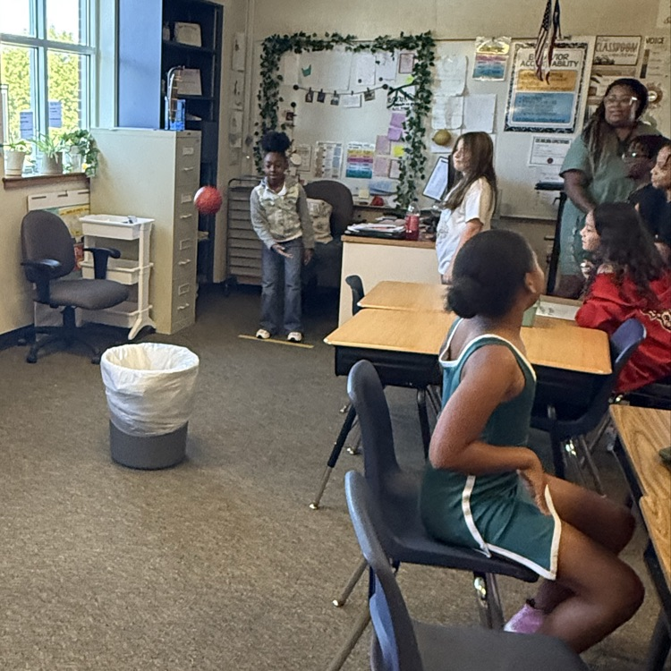 students playing a basketball review game in science class