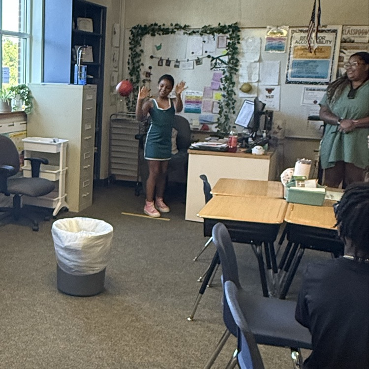 students playing a basketball review game in science class