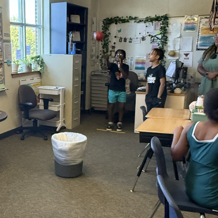 students playing a basketball review game in science class
