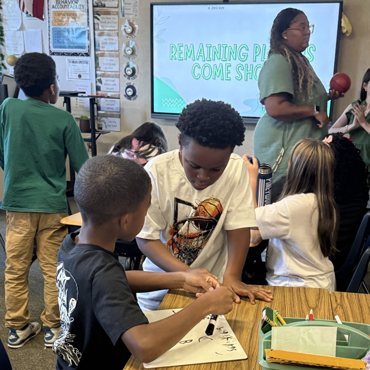 students playing a basketball review game in science class