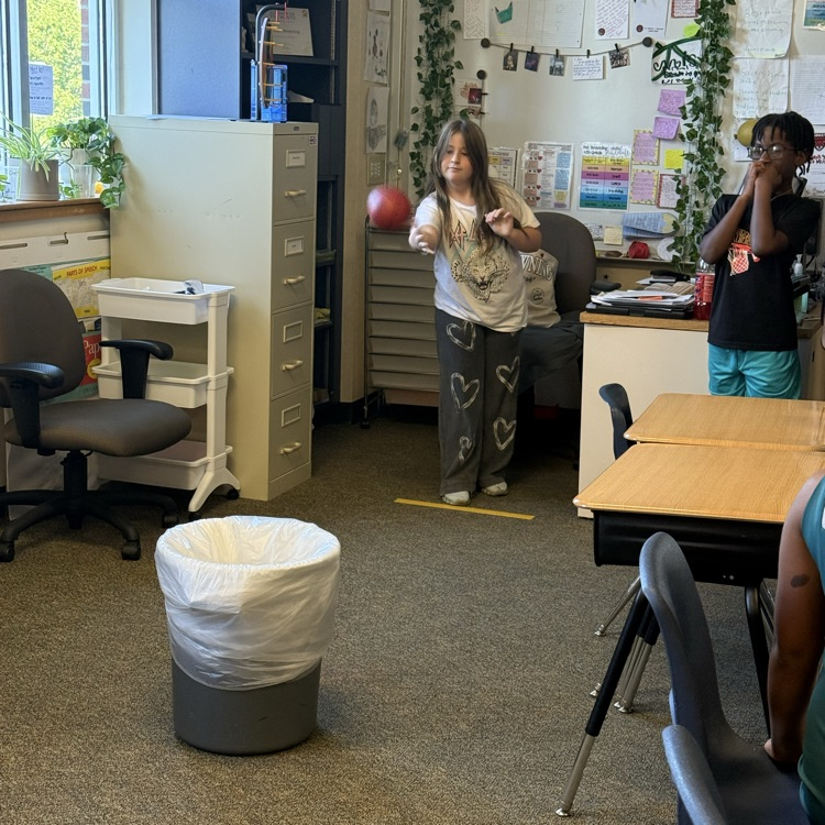 students playing a basketball review game in science class
