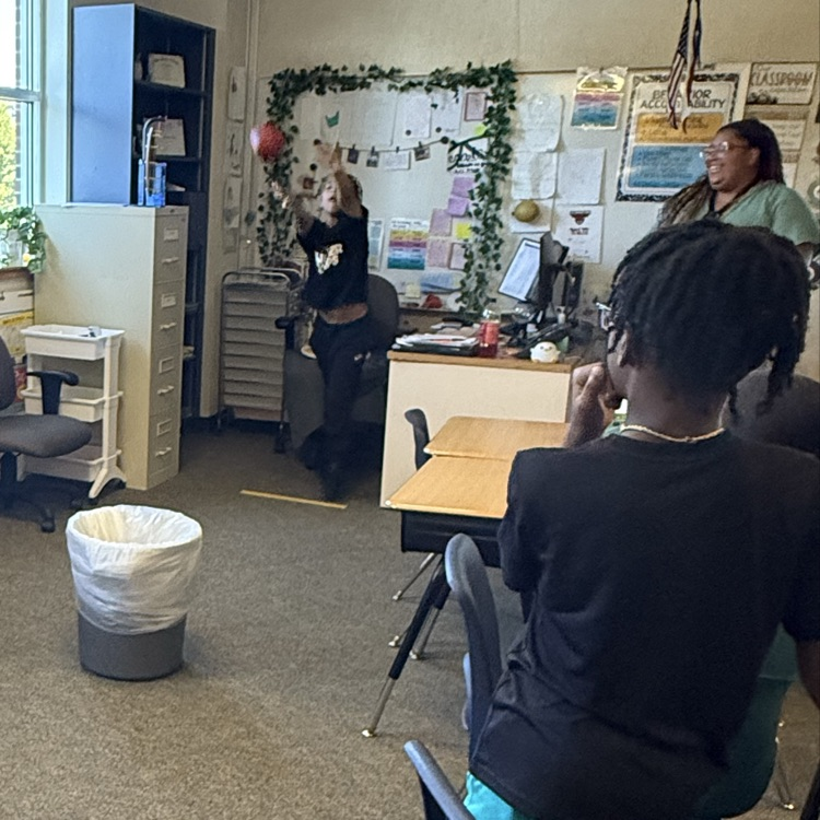 students playing a basketball review game in science class