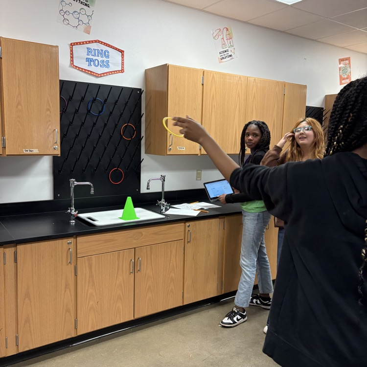 student playing carnival game 