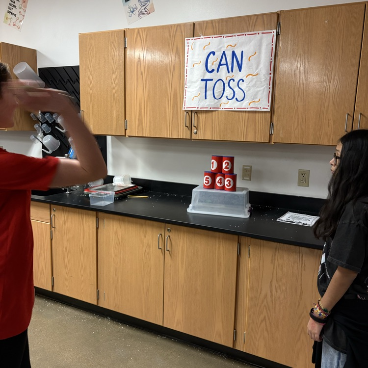 student playing carnival game 