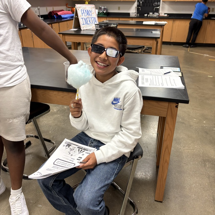 student playing carnival game 