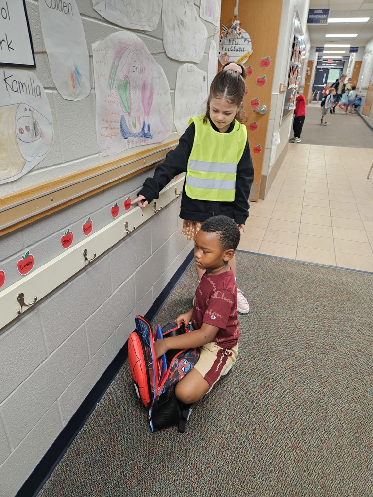 Safety team helping a student get unpacked.