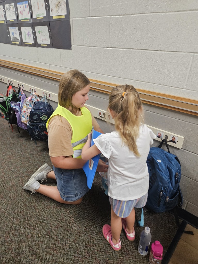 Safety team helping a student get unpacked.