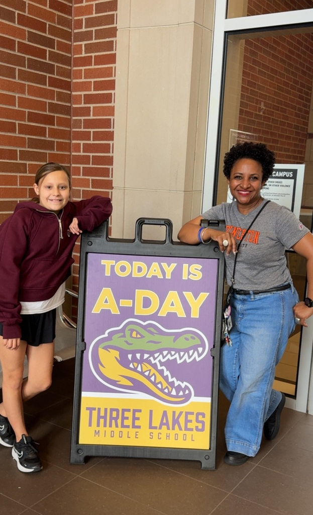 teacher and student wearing college shirts