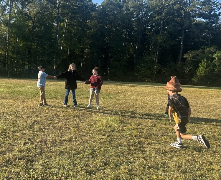 a group of kids chasing each other outside