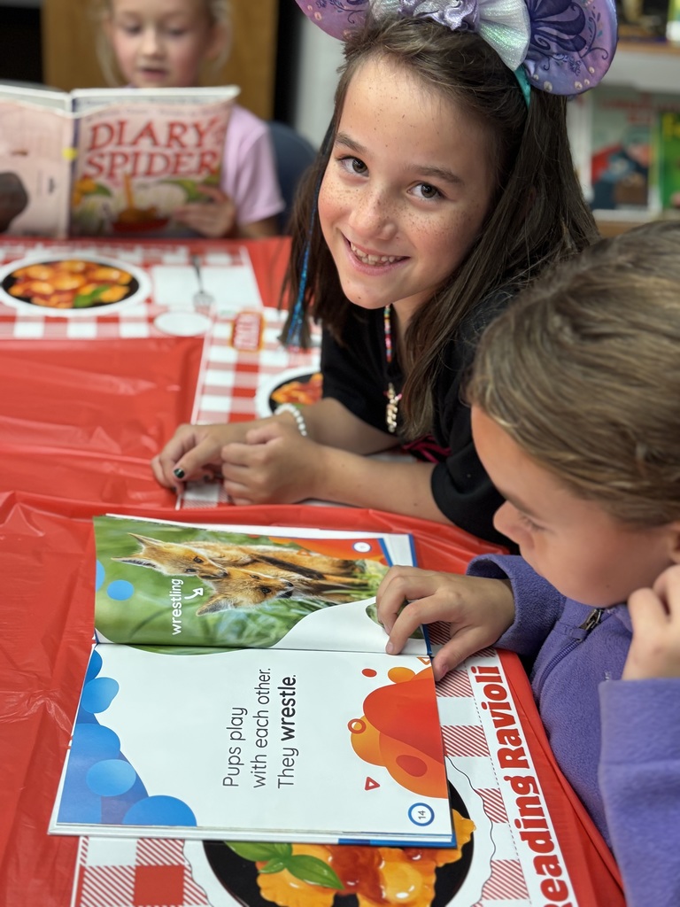 Students ready books for genre tasting.