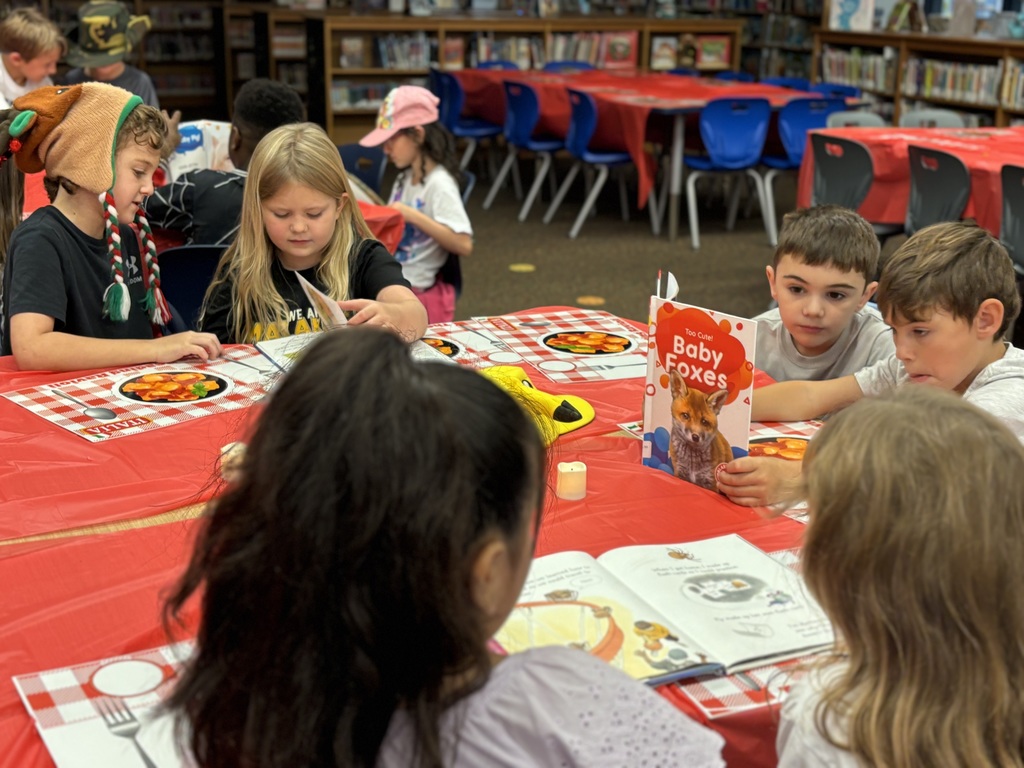 Students ready books for genre tasting.