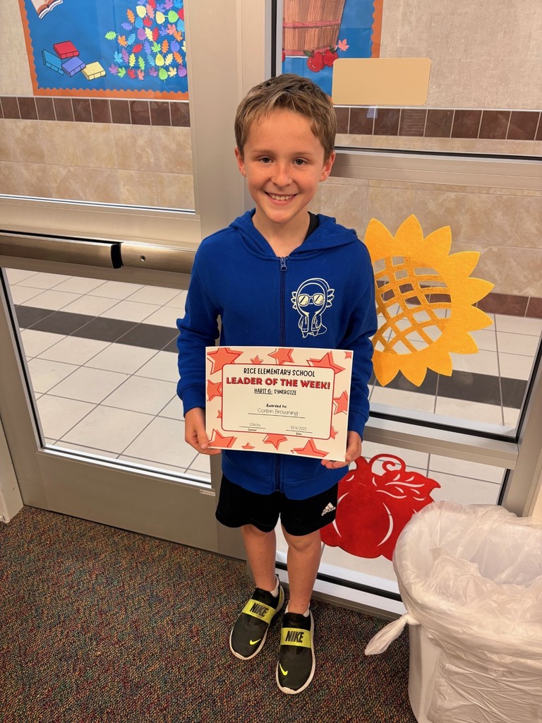 student holding a certificate
