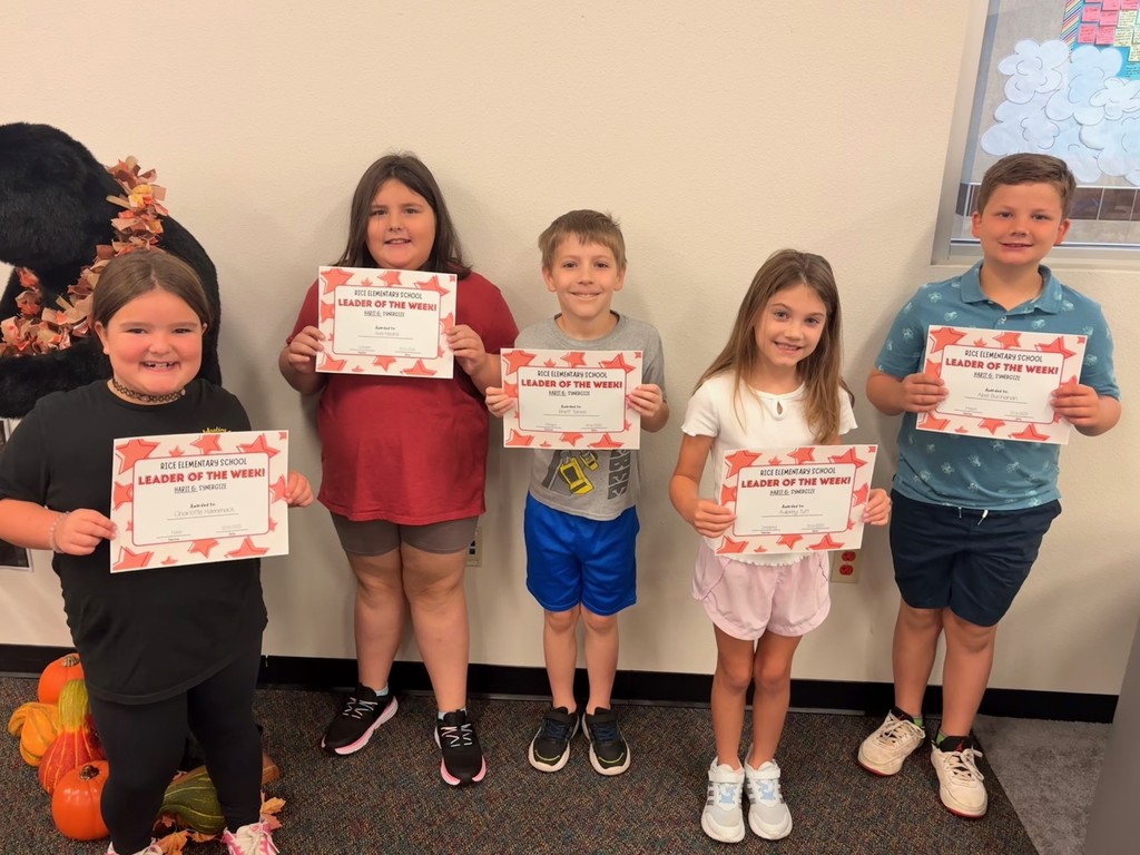 students holding certificates