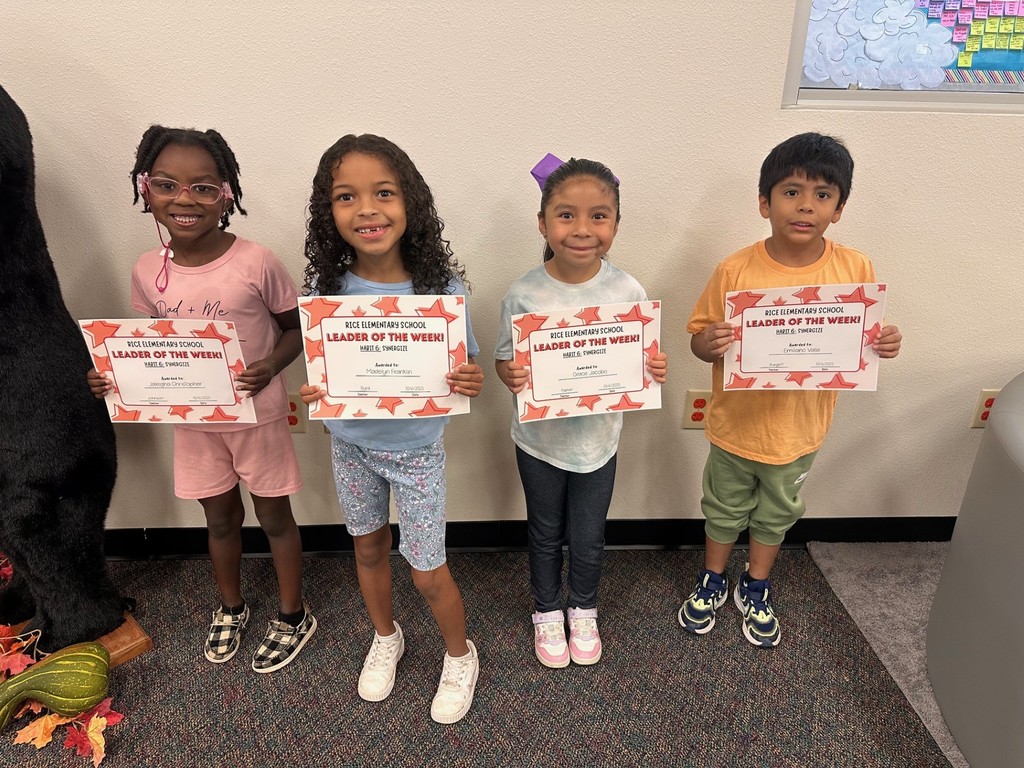 students holding certificates