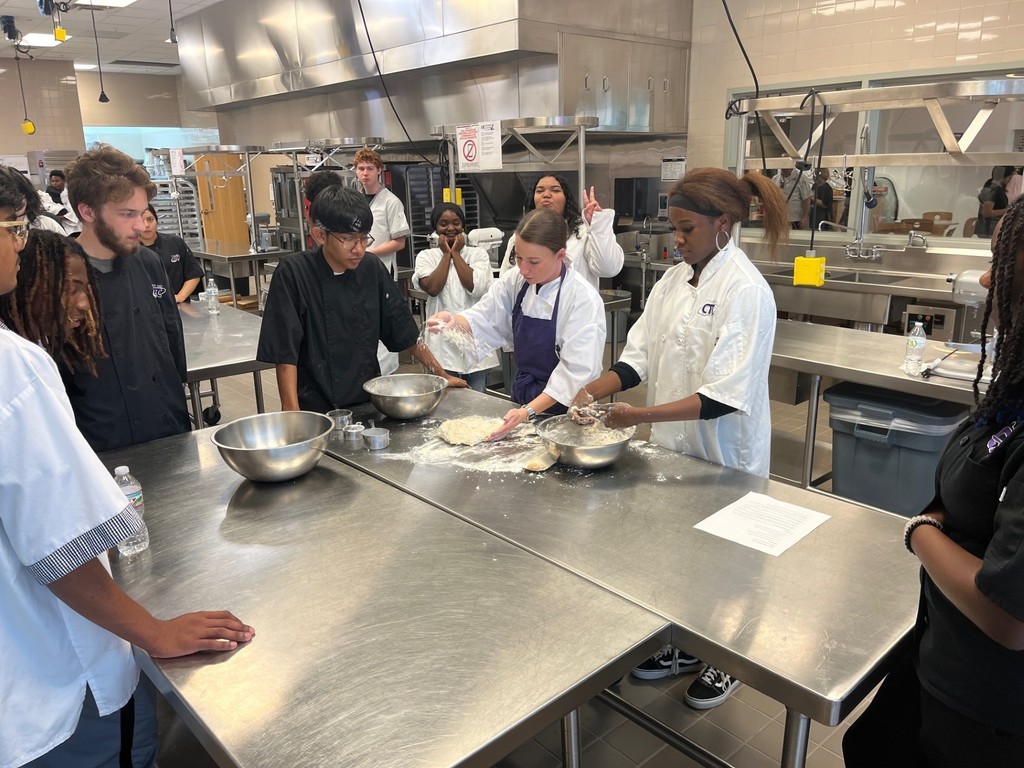 culinary students kneading dough