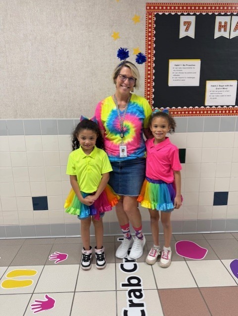 A teacher and students dressed up