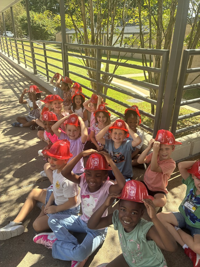 Students holder fireman hats.