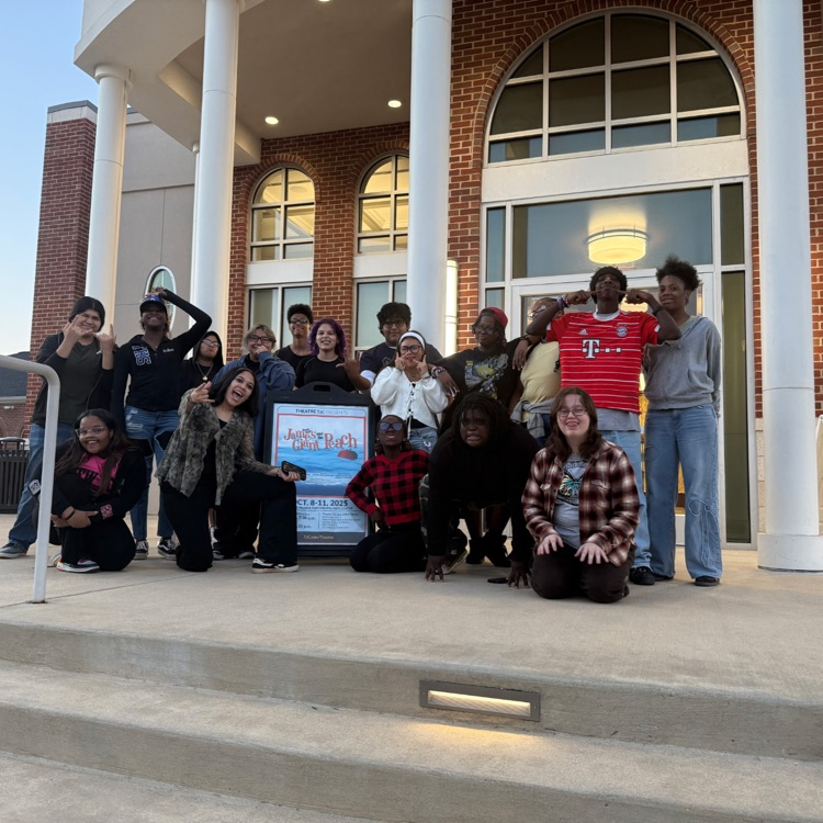 students on steps of theatre