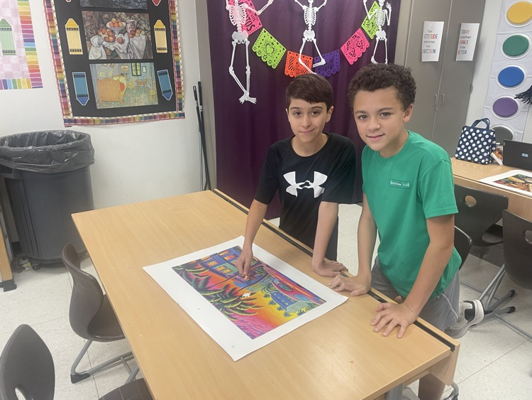 Two students in an art room.
