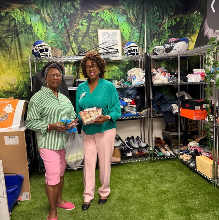 two ladies providing clothing 