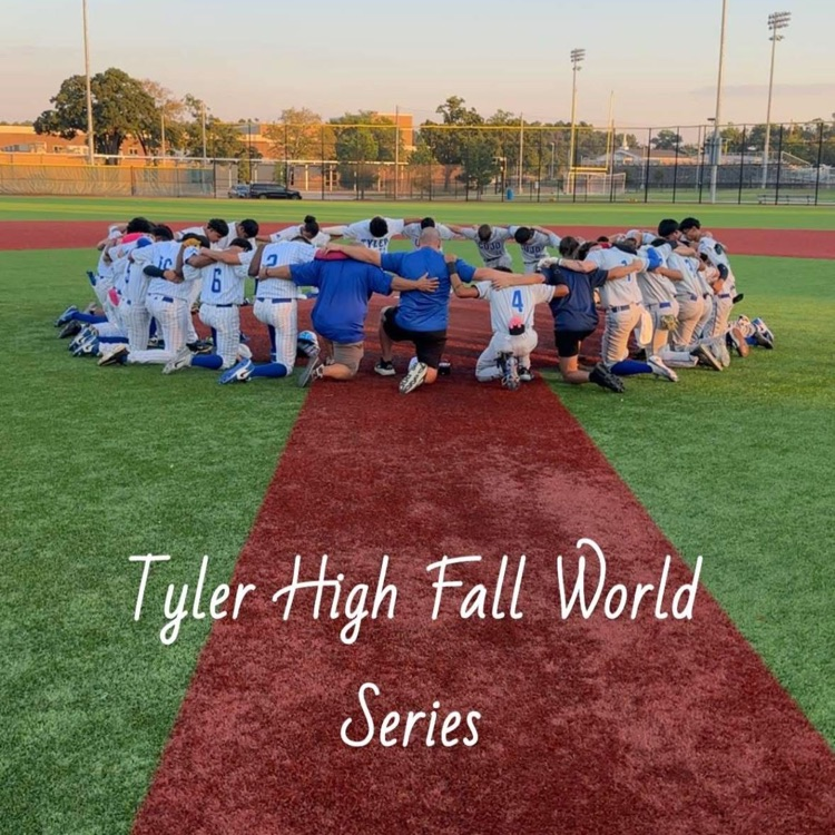 boys on field praying