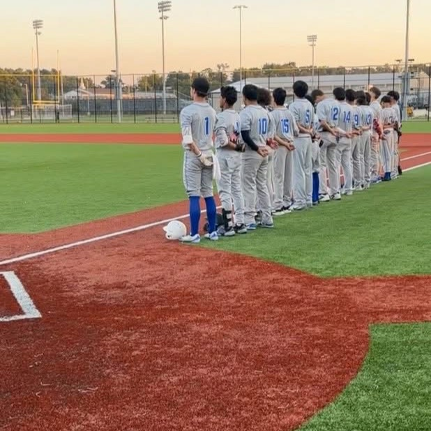 boys on field during national anthem 