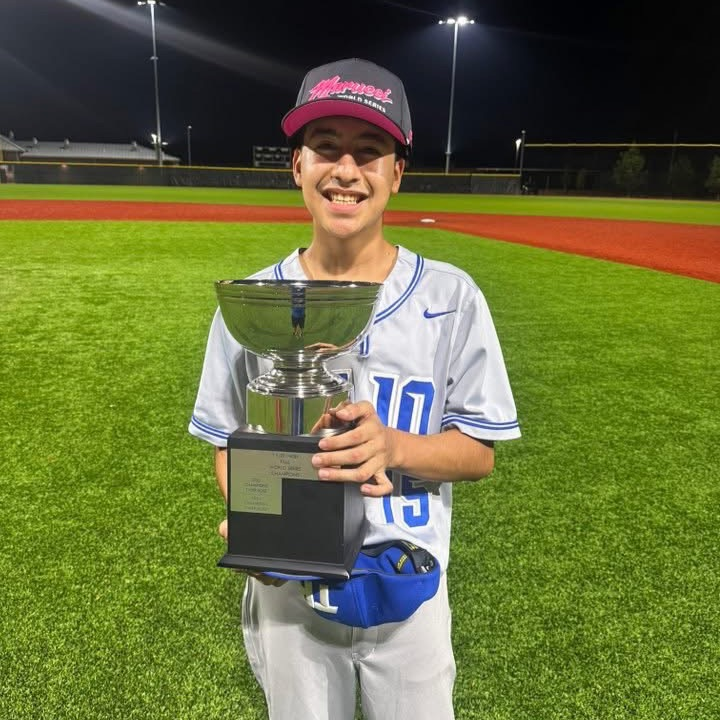 boy holding trophy