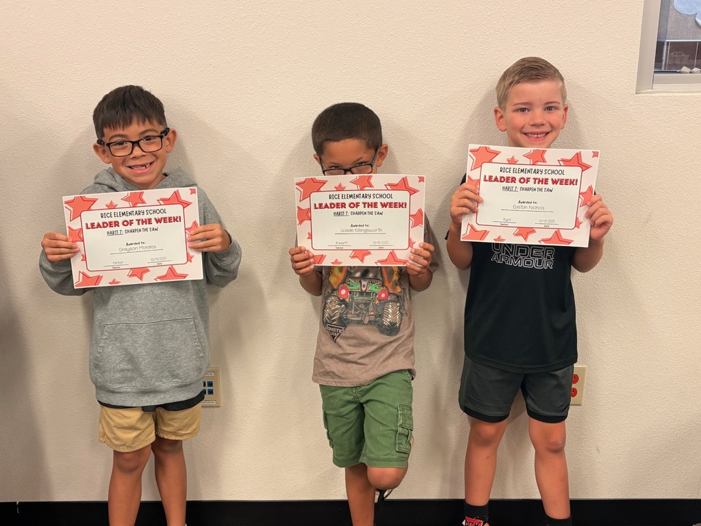 students holding certificates