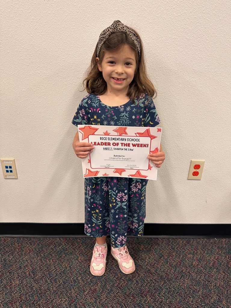 student holding a certificate