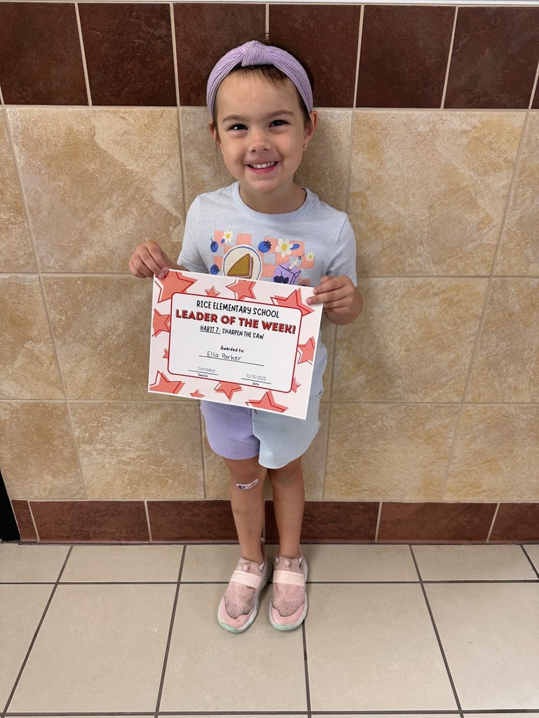 student holding a certificate