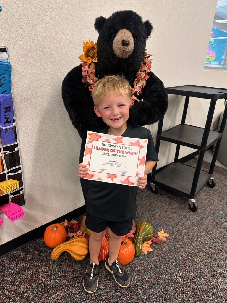 student holding a certificate