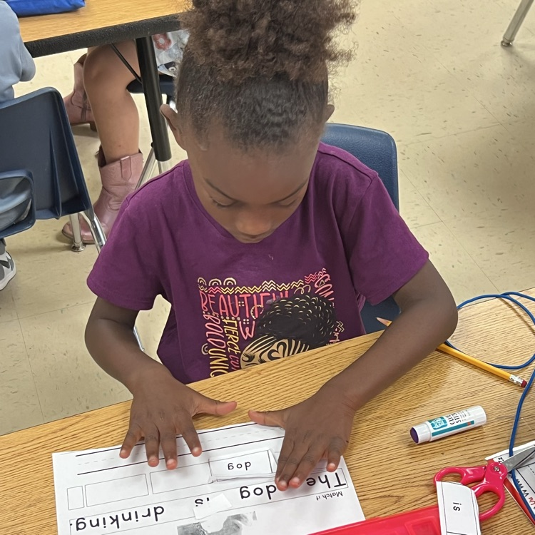 students working on using words to build full sentences