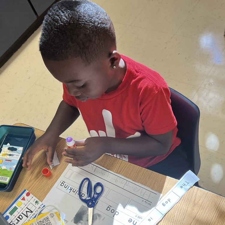students working on using words to build full sentences