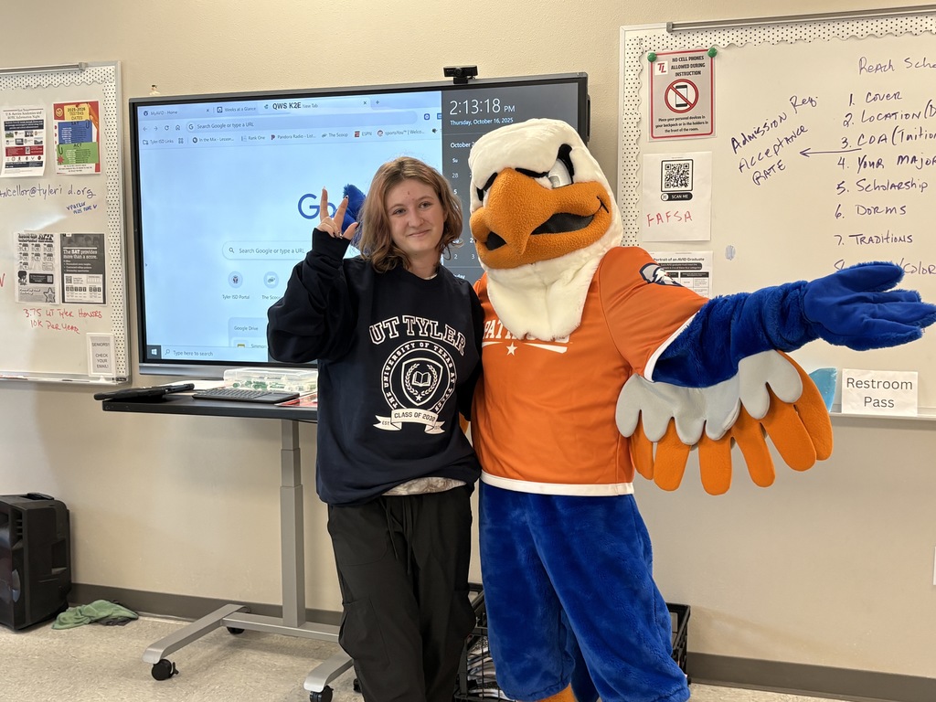 Representatives from UTTyler and Swoop awarding Tyler Legacy student their admittance box