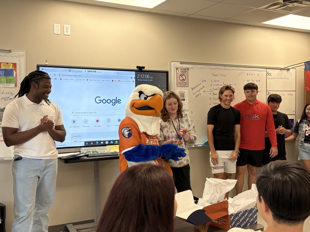 Representatives from UTTyler and Swoop awarding Tyler Legacy student their admittance box