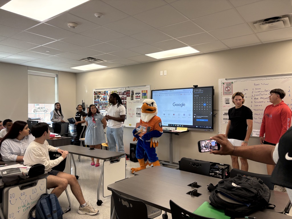 Representatives from UTTyler and Swoop awarding Tyler Legacy student their admittance box