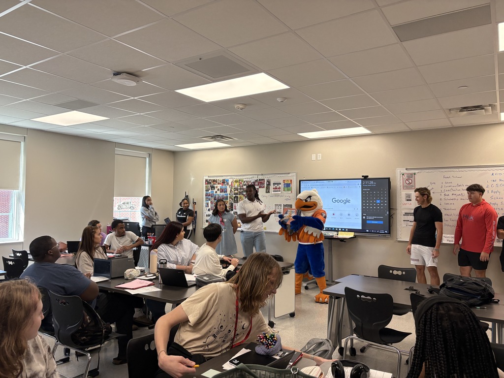 Representatives from UTTyler and Swoop awarding Tyler Legacy student their admittance box