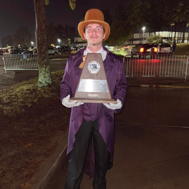 drum major holding trophy