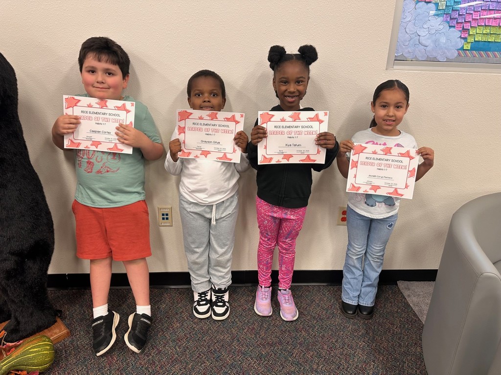 students holding certificates